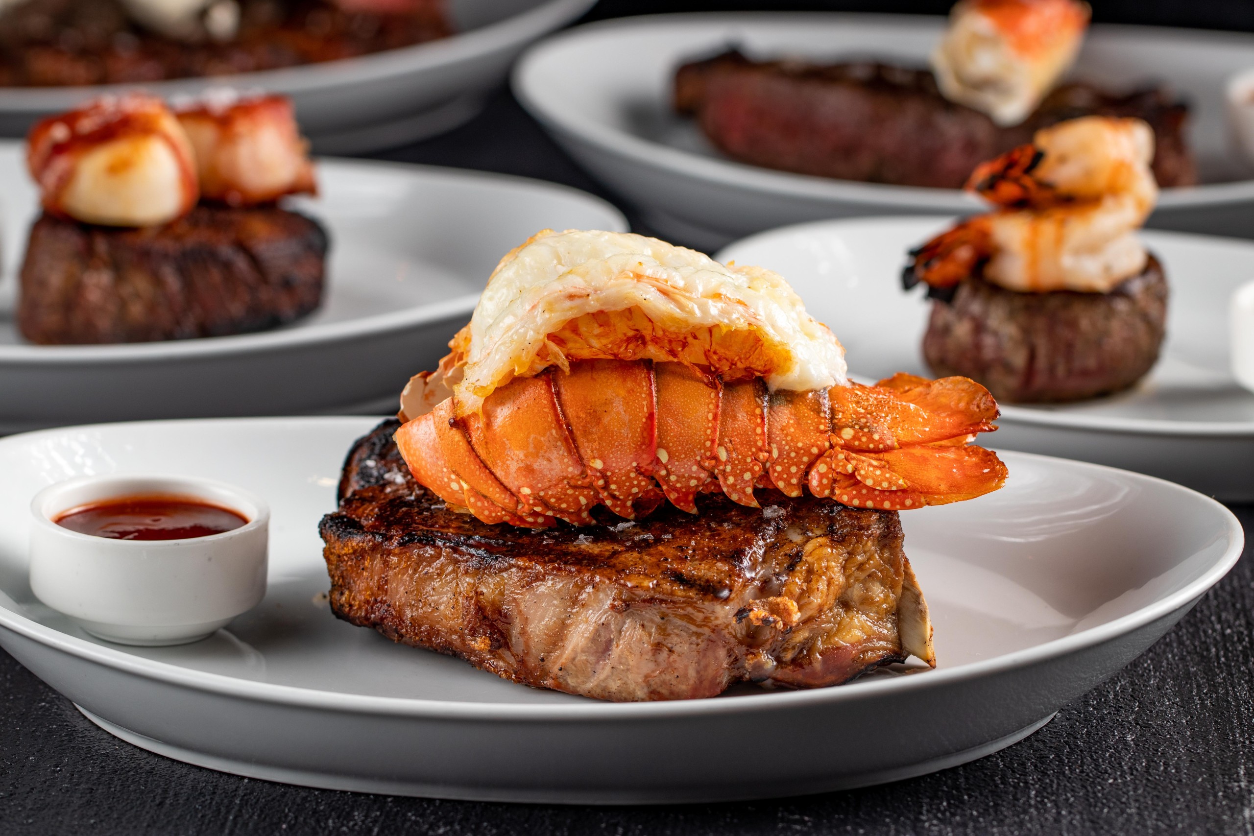 Plates of Surf and Turf served at an STK Steakhouse