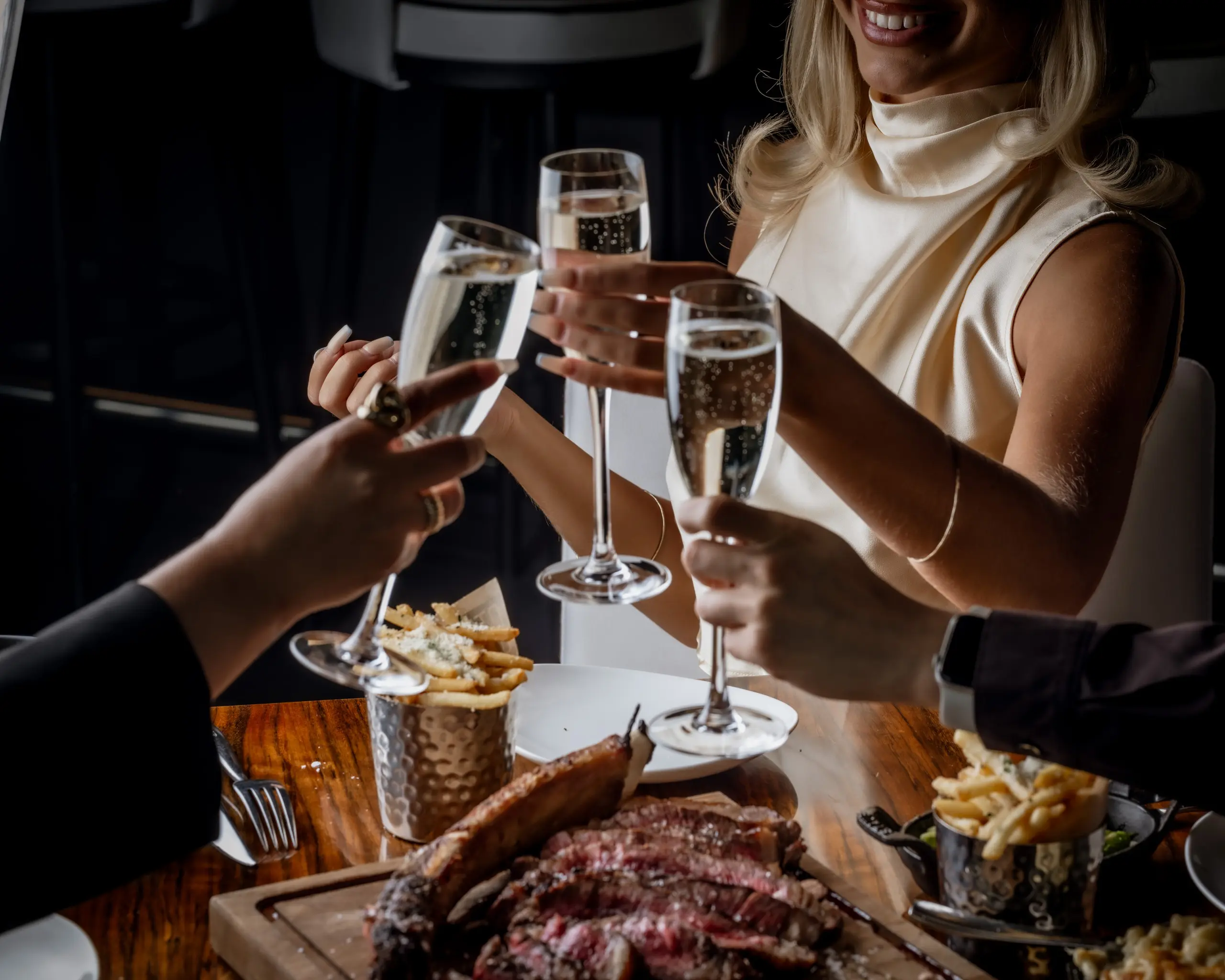 Cheers to STK. Diners enjoy a toast of Sparkling White Wine
