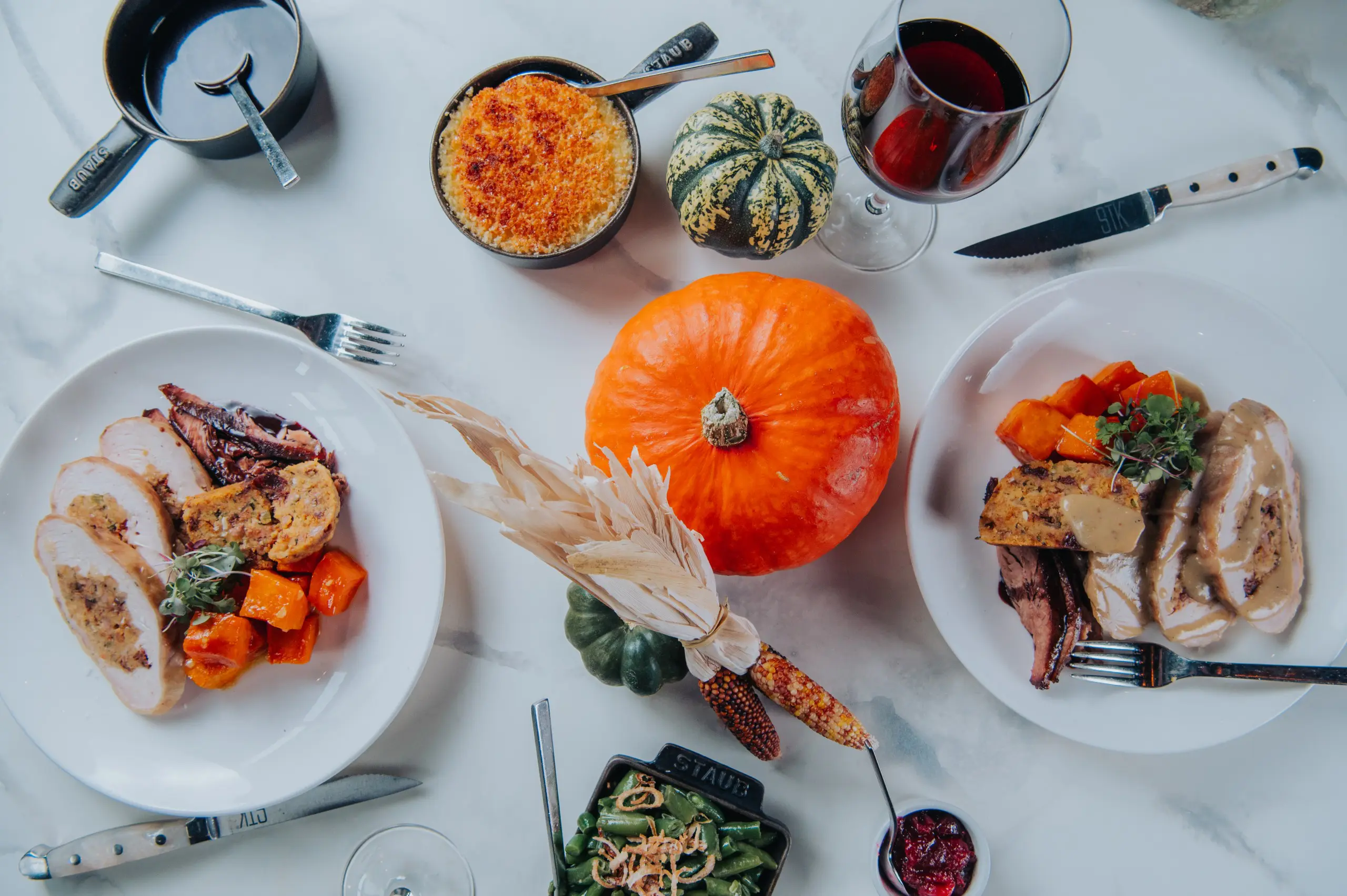 Table of Thanksgiving food items that look incredible.