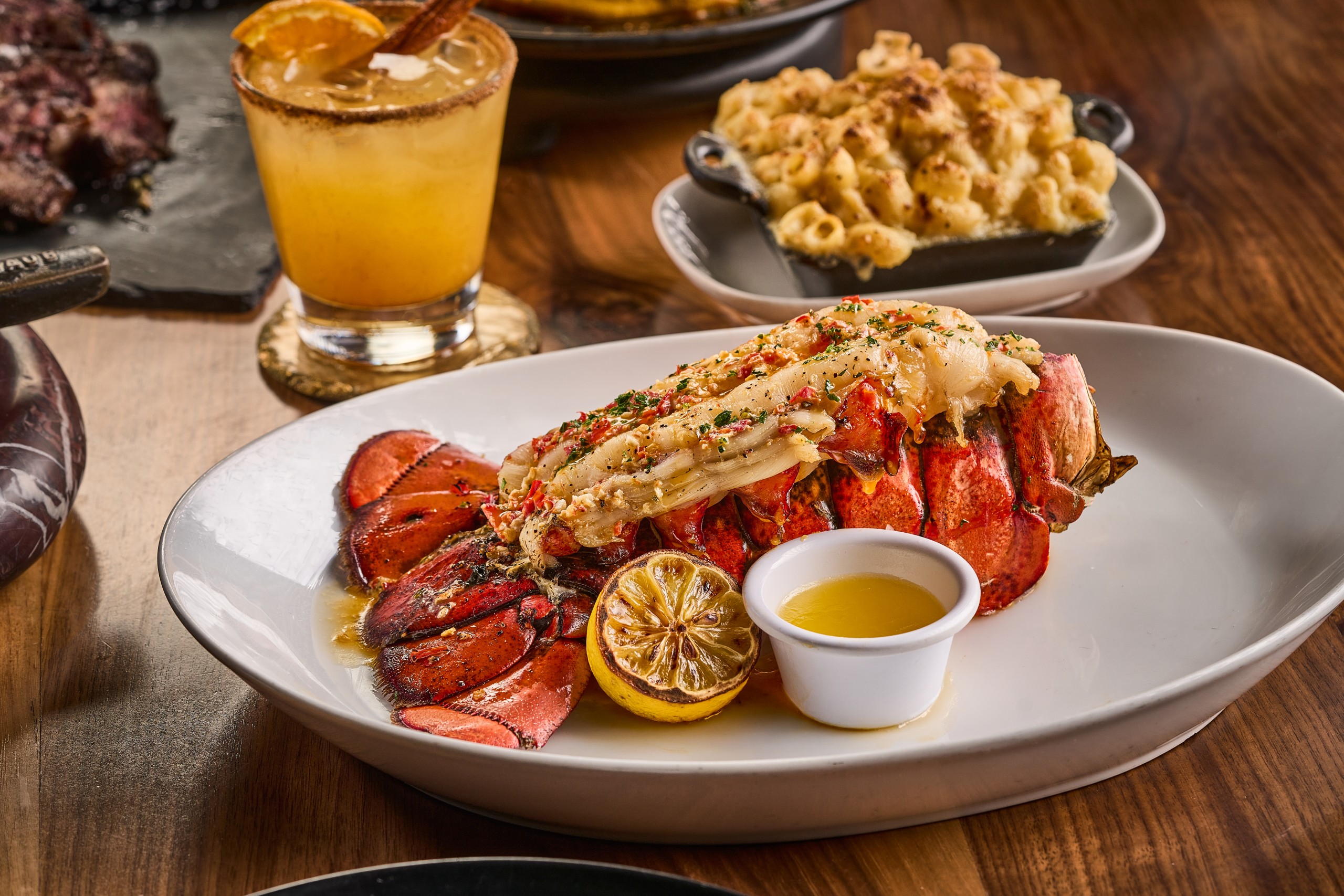 Tasty lobster with butter in a fall setting.